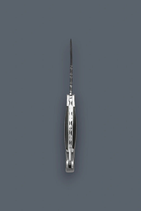 Vertical edge-on profile of the fully open The Squire Damascus folding knife showcasing the intricate spine filework and symmetrical handle assembly.